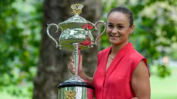 Ash Barty  poses with the Daphne Akhurst Memorial Cup (Australian Open women's trophy) at a park aft