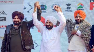 Punjab Chief Minister Charanjit Singh Channi (Centre) and Punjab Congress President Navjot Singh Sidhu (Left).