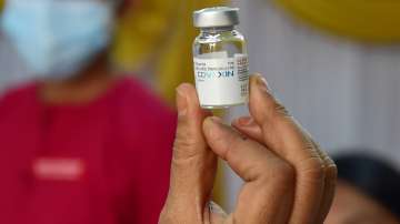 A medic displays a vial of Covaxin vaccine at a vaccination centre in Bengaluru.