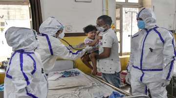 Doctors check a COVID-19 infected child at Jawaharlal Nehru hospital in Ajmer.