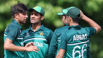 Pakistan U19 players celebrate after taking a wicket during a game in U19 World Cup 2022