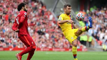 File photo of Crystal Palace's James McArthur (right) and Liverpool's Mohamed Salah.