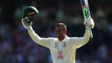 Usman Khawaja celebrates his century during day four of the Fourth Test Match in the Ashes series 