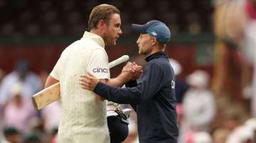 Broad shakes hands with Joe Root of England after the match ended in a draw on day five of the Fourt