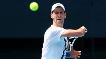 Serbia's Novak Djokovic practices on Rod Laver Arena ahead of the 2022 Australian Open at Melbourne 