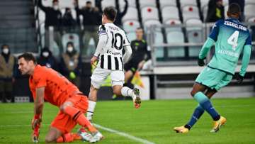 Juventus's Paulo Dybala (in white) celebrates a goal during a Serie A match against Udinese Calcio a