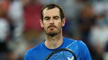 Andy Murray of Great Britain looks dejected after losing his second round singles match against Taro