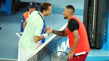 Daniil Medvedev of Russia and Nick Kyrgios of Australia shake hands after their match during day fou