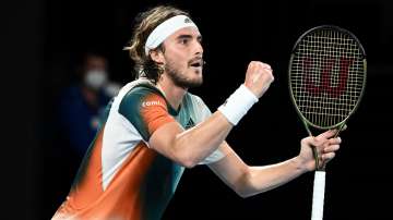Stefanos Tsitsipas celebrates after winning a point against Taylor Fritz at the Australian Open in M