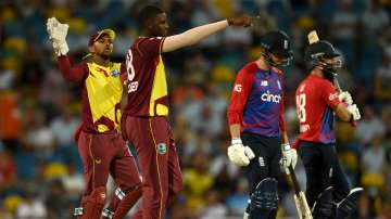 West Indies all-rounder Jason Holder (second from left) celebrates dismissing England captain Moeen Ali during the 5th T20I at Kensington Oval in Bridgetown, Barbados on Sunday.