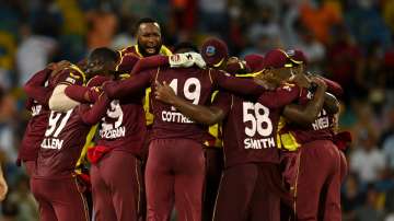 West Indies players celebrate winning the 5th T20 against England at Kensington Oval in Bridgetown, 