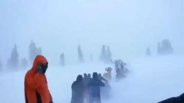 Tourists stuck in snowstorm rescued by snow-bike union in Gulmarg.