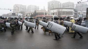 Riot police gather to block demonstrators during a protest in Almaty, Kazakhstan, Wednesday, Jan. 5, 2022. Demonstrators denouncing the doubling of prices for liquefied gas have clashed with police in Kazakhstan's largest city and held protests in about a dozen other cities in the country.