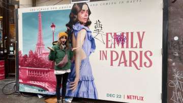 Lily Collins reacts to graffiti on poster of 'Emily in Paris'