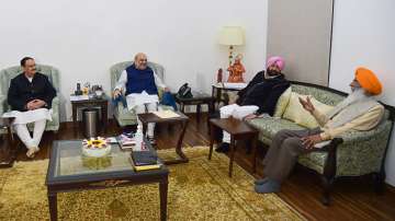 BJP president JP Nadda, Union Home Minister Amit Shah with former Punjab chief minister and Punjab Lok Congress (PLC) leader Captain Amarinder Singh and Shiromani Akali Dal (Sanyukt) president Sukhdev Singh Dhindsa during a meeting, ahead of 2022 Punjab assembly polls, in New Delhi, Monday, Dec. 27, 2021.