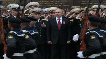 Russian President Vladimir Putin attends a parade marking the Victory Day in Sevastopol, Crimea, on May 9, 2014. Russia's present demands are based on Putin's purported long sense of grievance and his rejection of Ukraine and Belarus as truly separate, sovereign countries but rather as part of a Russian linguistic and Orthodox motherland.