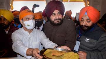 Congress leader Rahul Gandhi with PPCC President Navjot Singh Sidhu, Punjab CM Charanjit Singh Channi at Golden Temple in Amritsar