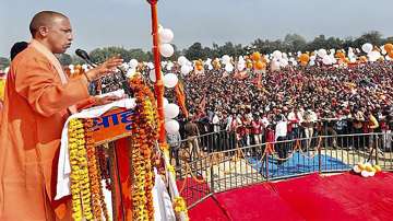 UP CM Yogi Adityanath addresses a rally for Assembly polls, in Ayodhya, Tuesday, Feb 22, 2022.