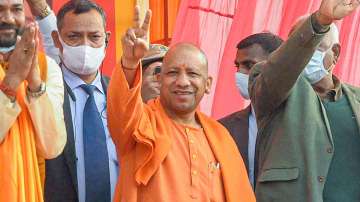 Uttar Pradesh Chief Minister Yogi Adityanath flashes victory sign during a programme?