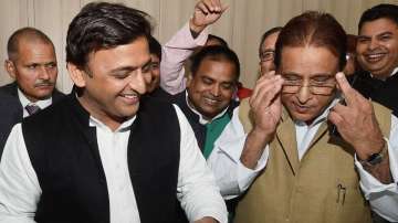 Samajwadi Party chief Akhilesh Yadav with party leader Azam Khan. 