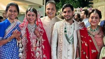 Khrisha Shah and Anmol Ambani with their families