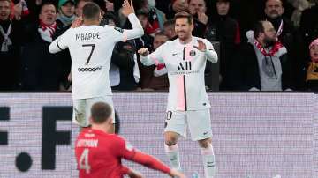 PSG's Lionel Messi celebrates with his teammate Kylian Mbappe after scoring his side's third goal du