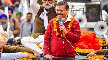 Arvind Kejriwal addresses the people during a roadshow in Phagwara ahead of Punjab Assembly elections.