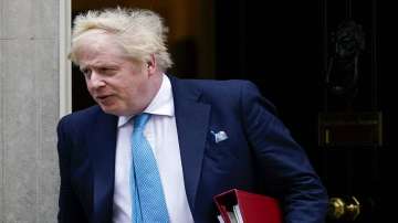 Britain's Prime Minister Boris Johnson leaves 10 Downing Street as he makes his way to the parliament to make a statement, in London, Thursday, Feb. 24, 2022. Russia launched a wide-ranging attack on Ukraine on Thursday, hitting cities and bases with airstrikes or shelling, as civilians piled into trains and cars to flee.