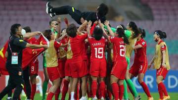 China's women football team celebrating win