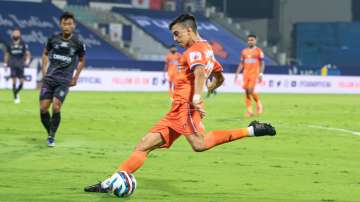 FC Goa player kicking the football during Odisha FC vs FC Goa game in the Indian Super League