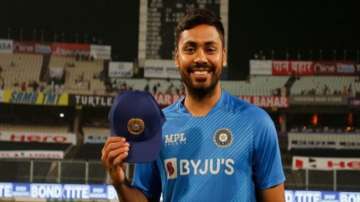 Avesh Khan poses after receiving the T20I cap