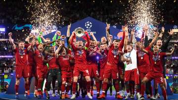 Jordan Henderson of Liverpool lifts the Champions League Trophy after winning the UEFA Champions Lea