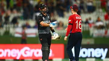 Daryl Mitchell of New Zealand interacts with Eoin Morgan of England following the ICC Men's T20 Worl