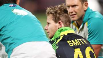 Steve Smith of Australia receives attention after hitting his head during AUS vs SL T20I match 