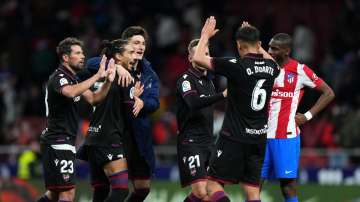 Levante players celebrate following victory against Atletico Madrid in La Liga at Estadio Wanda Metr
