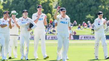 New Zealand's Matt Henry (centre) acknowledges the crowd after taking seven wickets during day one o