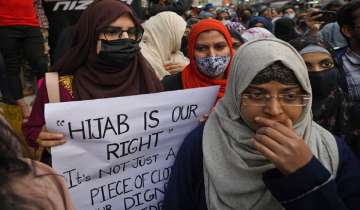 Muslim women participate in a march against banning Muslim girls wearing hijab from attending classes at some schools in the southern Indian state of Karnataka
