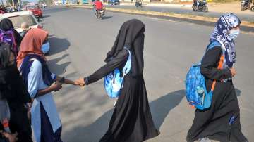 Students wearing hijab who were denied entry, outside IDSG Government College in Chikmagalur, Tuesday, Feb. 8, 2022.