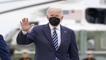 President Joe Biden waves as he boards Air Force One upon departure.