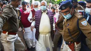 RJD chief Lalu Prasad Yadav arrives at the Special CBI Court to hear the verdict on the multi-crore Fodder Scam case, in Ranchi, Tuesday, Feb. 15, 2022.