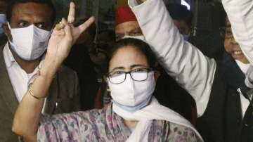 West Bengal Chief Minister Mamata Banerjee shows victory sign