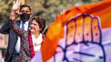 Priyanka Gandhi Vadra waves at the people, during a roadshow for the UP Assembly elections at Chinhat Bazar, in Lucknow.