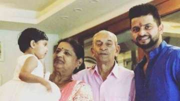 File photo of Suresh Raina with his family 