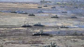 Tanks move during the Union Courage-2022 Russia-Belarus military drills at the Obuz-Lesnovsky training ground in Belarus, Saturday.