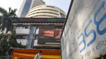 Pedestrians walk past the Bombay Stock Exchange (BSE) building, in Mumbai.