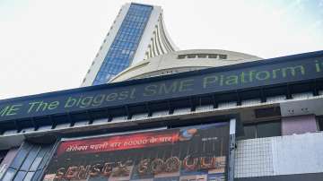 A screen displays Sensex crossing record 60,000 mark for the first time, at Bombay Stock Exchange (BSE) building, in Mumbai, Friday, Sept. 24, 2021.