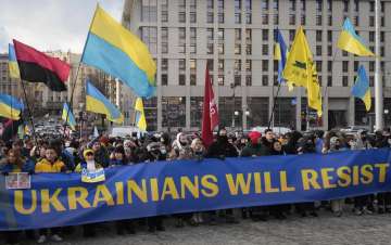 Ukrainians attend a rally in central Kyiv, Ukraine.