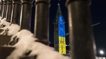 The Peace Tower on Parliament Hill is lit up with the colors of Ukraines national flag in a show of support following Russias invasion, in Ottawa, Ontario, Sunday, Feb. 27, 2022. 