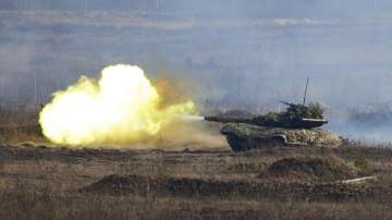 Ukrainian troops take part in a military drill outside the city of Rivne, northern Ukraine, Wednesday, Feb. 16, 2022.