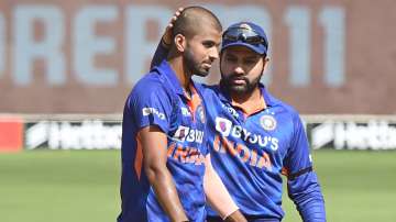 India's Washington Sundar with captain Rohit Sharma celebrates the wicket of West Indies Brandon Kin